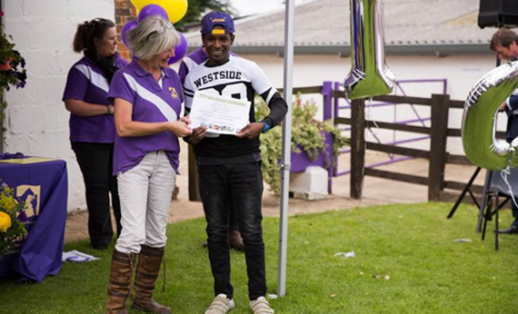 Abdul receiving a special Progression Award from Greatwood’s Managing Director, July 20